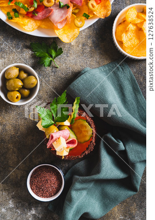 New gastronomic trend snacktails in a glass on the table top and vertical view New gastronomic trend snacktails in a glass on the table top and vertical view 127638524