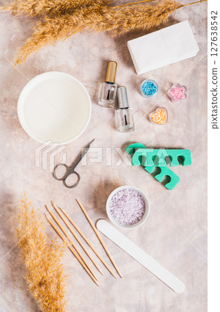 Set of items for manicure and pedicure on the table top and vertical view 127638542