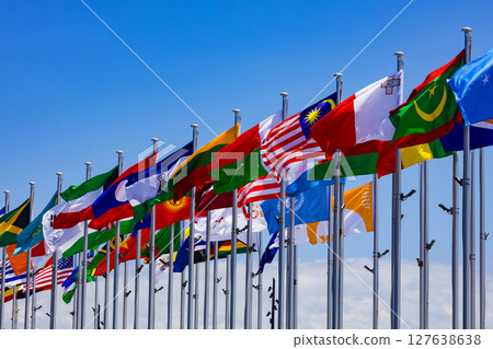 Flags of the nations flapping in the blue sky 127638638