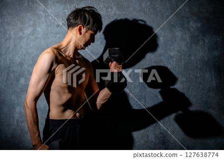 Men doing muscle training (weight training) 127638774