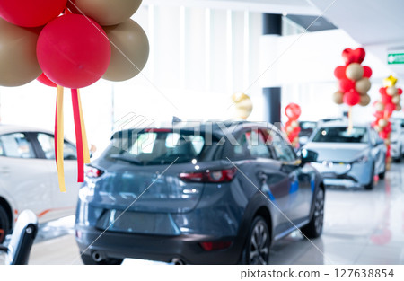 Car parked in luxury showroom. Car dealership office. Car showroom business. New car parked in modern showroom. Auto for sale and rent business. Automobile leasing and insurance. Electric automobile. 127638854