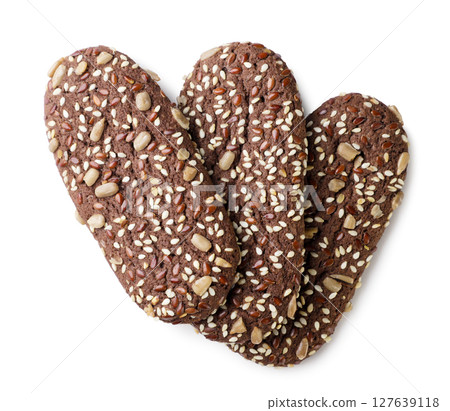 Chocolate cookies with sesame seeds on a white background. Top view 127639118