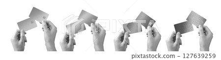 Bank card held in hand. Premium, elegant plastic credit and debit cards in gray, black, grayscale 127639259