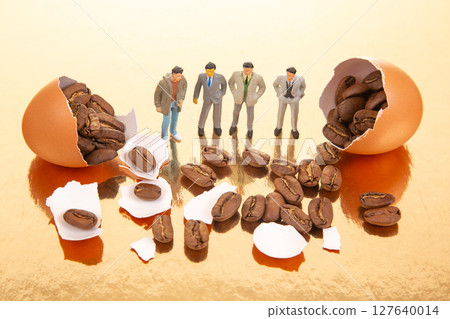 still life with tiny people in suits and wear near broken orange eggs filled with coffee beans still life with tiny people in suits and wear near broken orange eggs filled with coffee beans 127640014