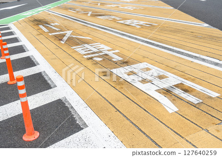 A photo of a parking lot reserved for large buses. A photo of a parking lot reserved for large buses. 127640259