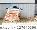 A picture of the garbage at the construction site. 127640290