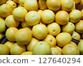 A photo of grapefruits being sold in a store. 127640294