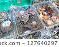 A photo of delicious looking shellfish being sold at the store. 127640297