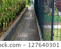 A photo of a narrow alleyway taken in Japan. 127640301