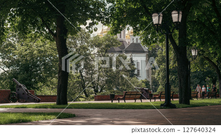 The peaceful park setting enhances the spiritual aura of the scene. 127640324