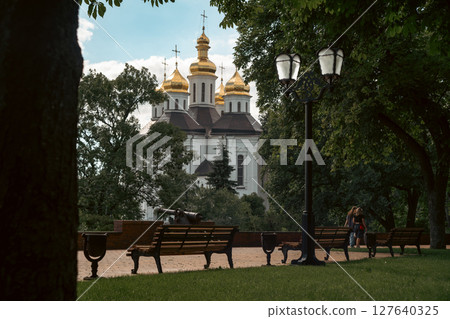 The peaceful park setting enhances the spiritual aura of the scene. 127640325