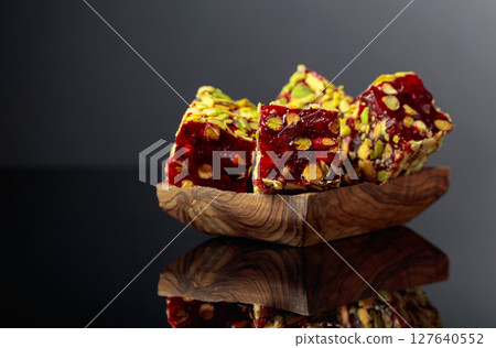 Traditional Turkish delight in a wooden dish. 127640552