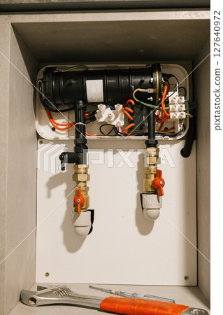 Indoor heating system maintenance with tools and pipes Indoor heating system maintenance with tools and pipes 127640972
