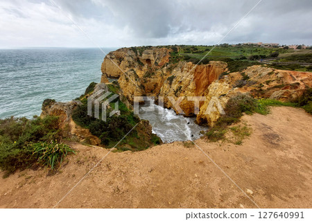 Scenic Coastal Cliffs and Rock Formations by the Sea 127640991