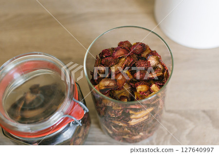 Glass Jars with Dried Fruit on Kitchen Counter Glass Jars with Dried Fruit on Kitchen Counter 127640997
