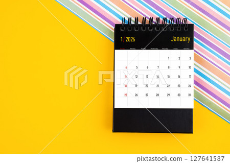 Desk calendar for January 2026 year on yellow color background, Position with copy space. Desk calendar for January 2026 year on yellow color background, Position with copy space. 127641587