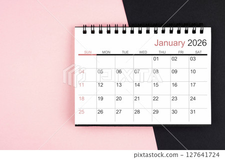 January 2026 desk calendar on pink and black color background, Flat lay. 127641724