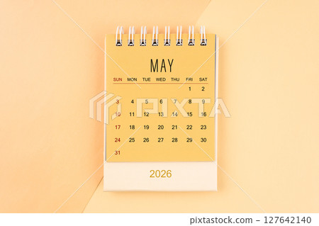 May 2026 mini desk calendar on the yellow, planning for business meeting concept. May 2026 mini desk calendar on the yellow, planning for business meeting concept. 127642140