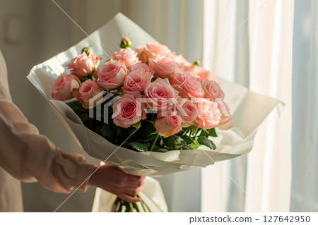 a woman holding a bouquet of roses.ai generative 127642950