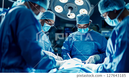 Photo of a male doctor performing surgery in an operating room. Generative AI Photo of a male doctor performing surgery in an operating room. Generative AI 127643185