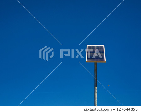 Photovoltaic panel converting sunlight into electricity on blue sky copy space 127644853