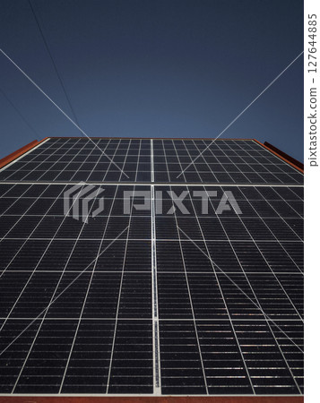 Solar panels gleaming under clear sky, capturing renewable energy in aosta, italy during bright autumn sunlight targnod 127644885