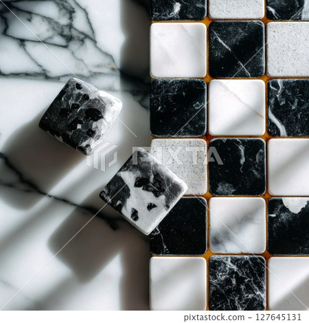 Black and white marble chessboard tile pattern in top-down natural lighting setup 127645131