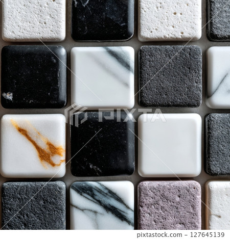 Black and white marble ceramic tiles with flat matte and glossy finishes in mosaic layout 127645139