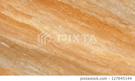 Orange travertine stone surface with rich sediment layers and natural texture bands 127645144