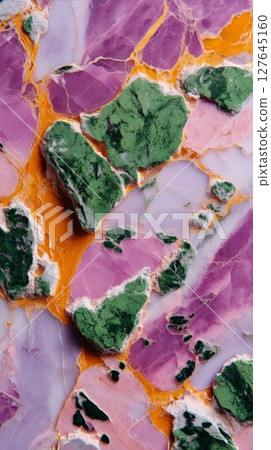 Violet semiprecious marble with bright orange and green fractured mineral composition 127645160