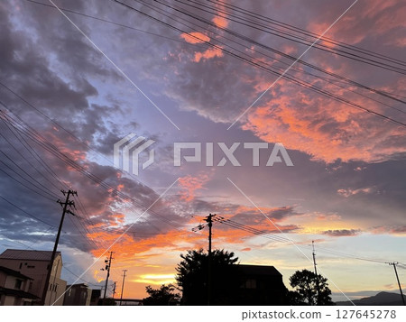 Sunset sky seen from a residential area Sunset sky seen from a residential area 127645278