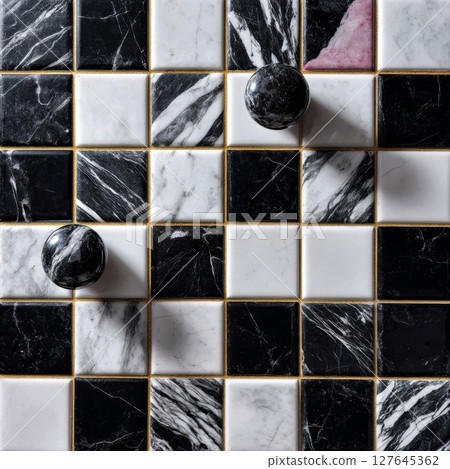 Checkerboard mosaic of Nero Marquina and Carrara marble with sculptural spheres 127645362