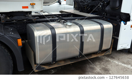 Metal fuel tank mounted on a truck tractor provides vital support for long-distance travels in urban environments, ensuring efficient fuel supply for transportation needs. Metal fuel tank mounted on a truck tractor provides vital support for long-distance travels in urban environments, ensuring efficient fuel supply for transportation needs. 127645638