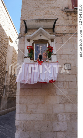 Street in old town at Bari in Apulia. Bari is the capital city of Apulia region on the Adriatic sea, in southern Italy 127645810