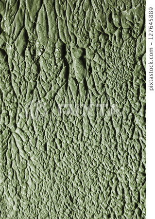 Vertical photo of rough plaster. 127645889