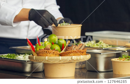 Chef preparing food at a farmers market cooking demo Chef preparing food at a farmers market cooking demo 127646285