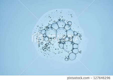 Delicious serum texture with bubbles on a blue background. Delicious serum texture with bubbles on a blue background. 127646296