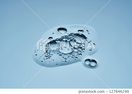 Delicious serum texture with bubbles on a blue background. 127646299