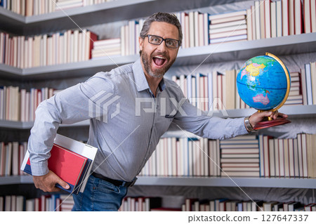 school teachers education and knowledge. education in college. teacher in class. teachers day. college teacher. man teacher in classroom. school lesson. Hispanic teacher at school. Knowledge is power 127647337