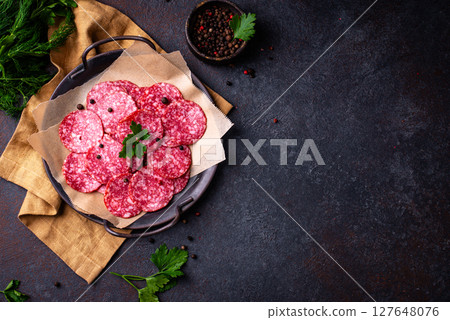 Sliced spicy tasty salami sausage 127648076
