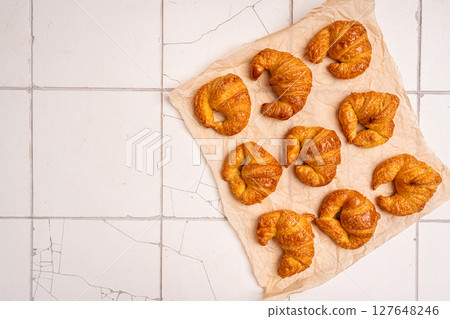 Homemade freshly baked in oven mini croissants Homemade freshly baked in oven mini croissants 127648246
