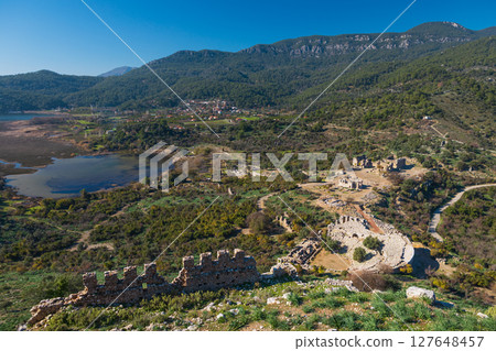 View from acropolis on top of mount to famous ancient Greek city Kaunos in Caria or Caunus in Roman period in Anatolia. Popular place for family travel on summer vacation. Dalyan, Mugla, Turkey 127648457