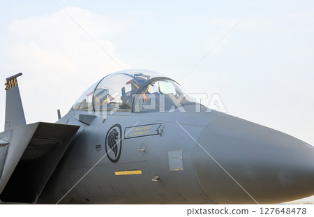 Close up Boeing F-15SG Multi-Role Fighter cockpit side view at airshow. Close up Boeing F-15SG Multi-Role Fighter cockpit side view at airshow. 127648478