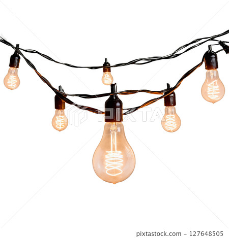 Decorative warm lights hanging in a creative arrangement for evening outdoor ambiance Decorative warm lights hanging in a creative arrangement for evening outdoor ambiance 127648505