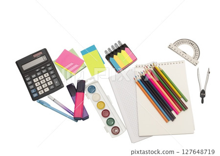 School and office supplies, pens, pencils, ruler, compass, calculator on a white background. School and office supplies, pens, pencils, ruler, compass, calculator on a white background. 127648719