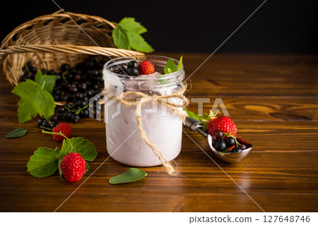 Berry ice cream with natural ingredients on wooden background Berry ice cream with natural ingredients on wooden background 127648746