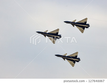 J-10 of China Air Force Aerobatics team on fly formations at airshow. J-10 of China Air Force Aerobatics team on fly formations at airshow. 127648867