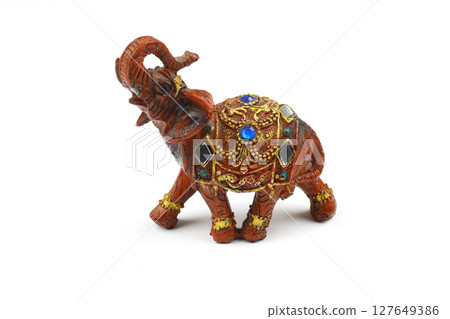 a small elephant statues with white background. 127649386