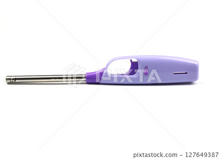 Clear dark blue cigarette lighter isolated on white background with clipping path. Cheap used disposable plastic gas lighter isolated. Close up shot of old lighter. High resolution macro shooting Clear dark blue cigarette lighter isolated on white background with clipping path. Cheap used disposable plastic gas lighter isolated. Close up shot of old lighter. High resolution macro shooting 127649387
