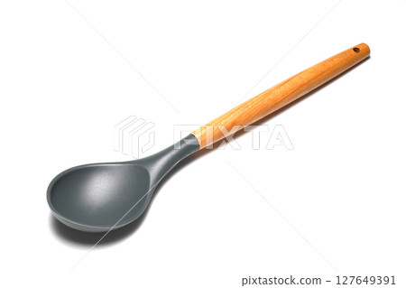 Wooden spoon on a white background. Wooden dishes. Isolate on a white background. 127649391